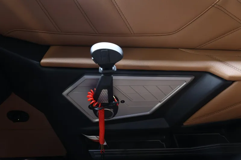 Slide: The Image of Interior detail of 2025 Tigé Ultré 25ZX boat, featuring sleek design and modern controls. - 29