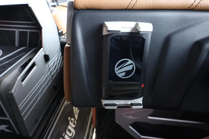 Slide: The Image of Interior of 2025 Tigé Ultré 25ZX boat with mounted device holder. - 30