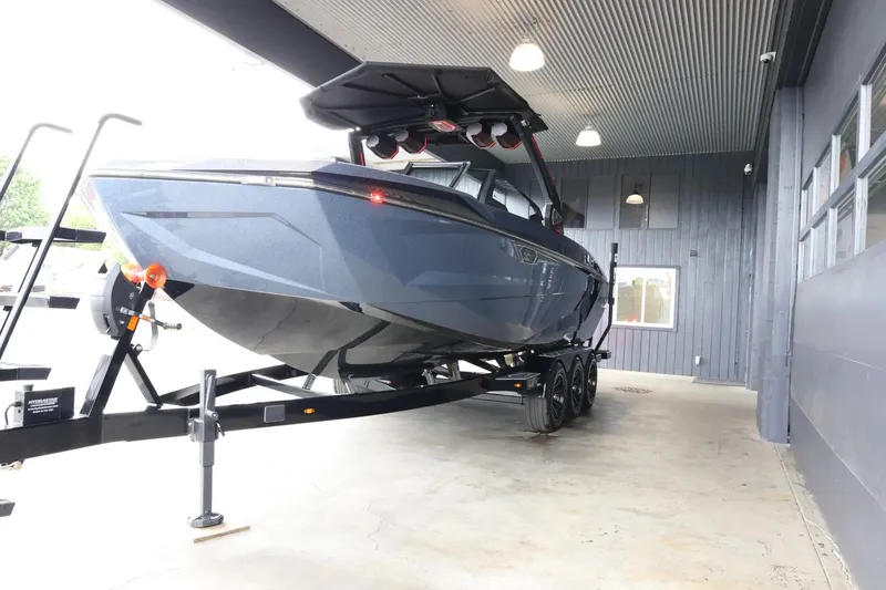Slide: The Image of 2025 Tigé Ultré 25ZX boat on trailer in covered storage area. - 4