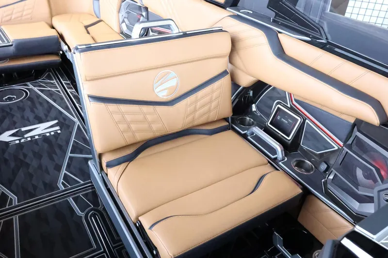 Slide: The Image of 2025 Tigé Ultré 25ZX interior with tan leather seating and modern design elements. - 40