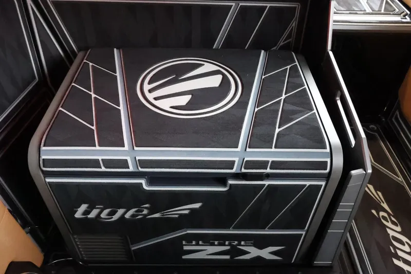 Slide: The Image of 2025 Tigé Ultré 25ZX boat interior with sleek, modern design and branding. - 43