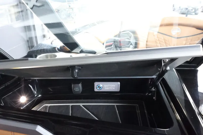 Slide: The Image of 2025 Tigé Ultré 25ZX boat battery switch compartment with sleek design. - 46