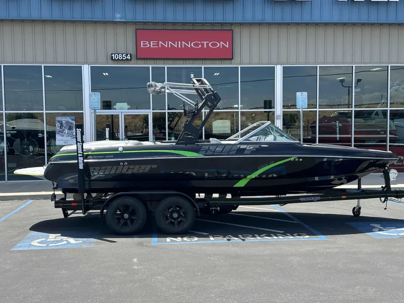 Slide: The Image of 2024 Sanger V215 S boat in front of Bennington dealership. - 1