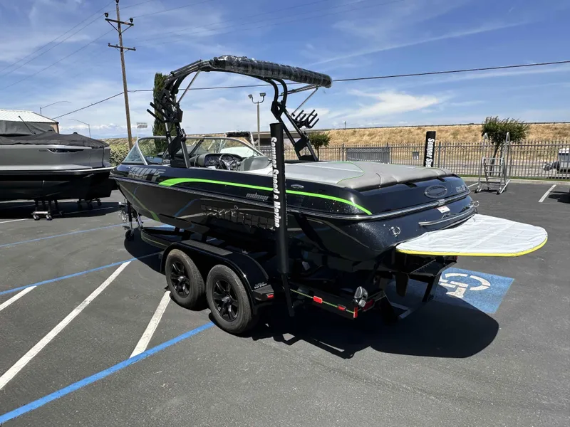 Slide: The Image of 2024 Sanger V215 S boat on trailer in parking lot, sunny day. - 10