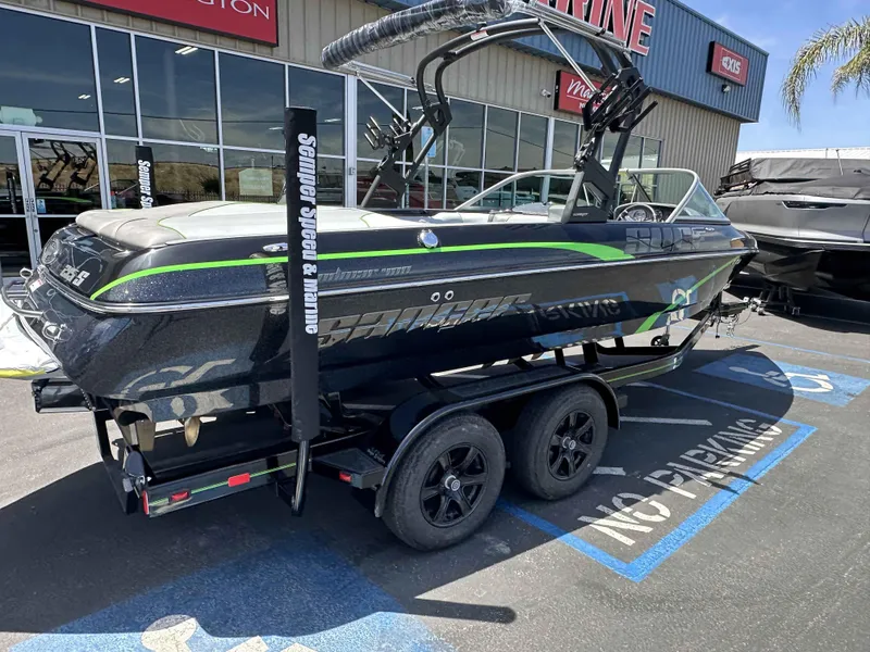 Slide: The Image of 2024 Sanger V215 S boat on trailer outside marine dealership. - 16