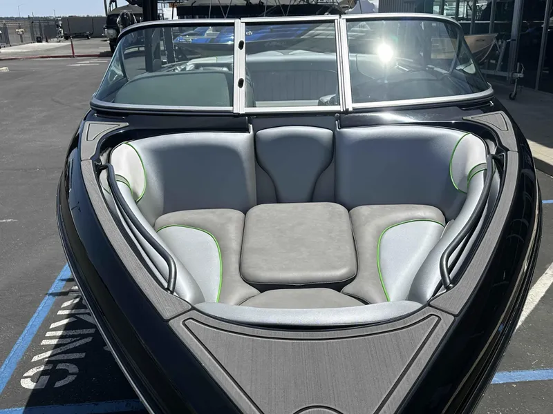 Slide: The Image of 2024 Sanger V215 S boat interior with gray and green cushioned seating. - 3