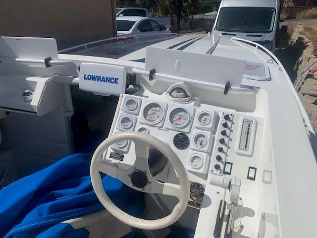 Slide: The Image of Cockpit of a 1995 Ultimate Warlock 29 World Class boat with navigation instruments. - 3