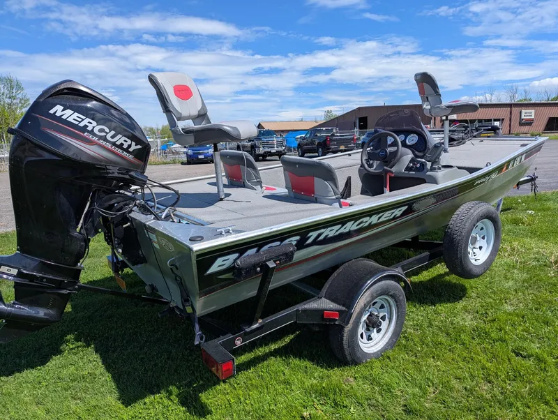 Slide: The Image of 2013 Tracker Pro 170 boat with Mercury engine on trailer, parked on grass. - 14