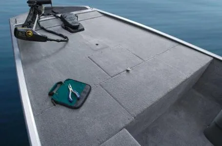 Slide: The Image of 2013 Tracker Pro 170 boat deck with fishing tools and trolling motor. - 7