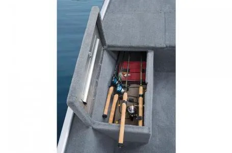 Slide: The Image of 2013 Tracker Pro 170 boat storage compartment with fishing rods and gear. - 8