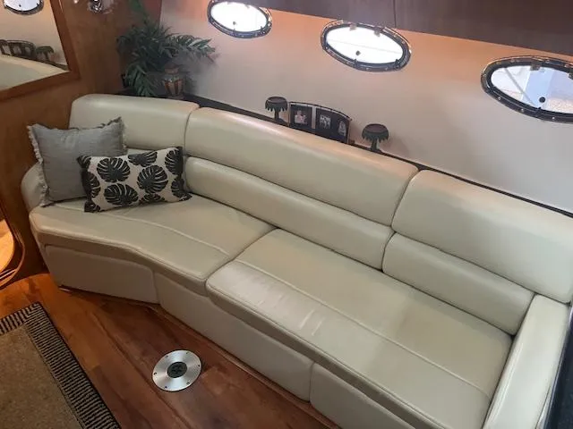 Slide: The Image of Luxurious interior of 2003 Regal 3860 yacht with cream leather seating and decorative pillows. - 13