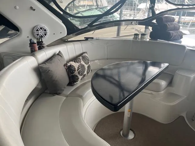 Slide: The Image of Luxurious 2003 Regal 3860 yacht interior with plush seating and elegant table. - 14