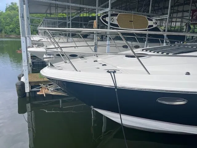 Slide: The Image of 2003 Regal 3860 yacht docked in a marina, featuring sleek design and modern amenities. - 2