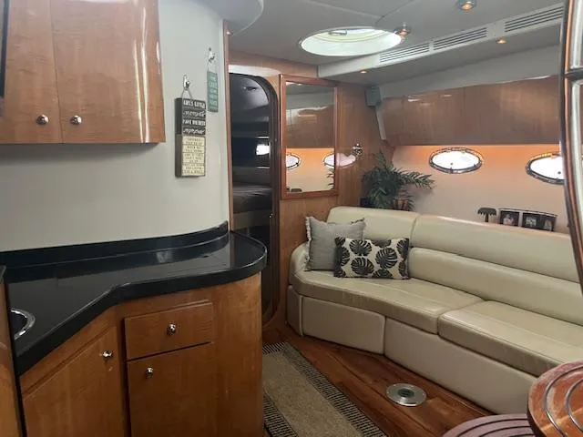 Slide: The Image of Luxurious interior of a 2003 Regal 3860 yacht with elegant wood finishes and plush seating. - 31