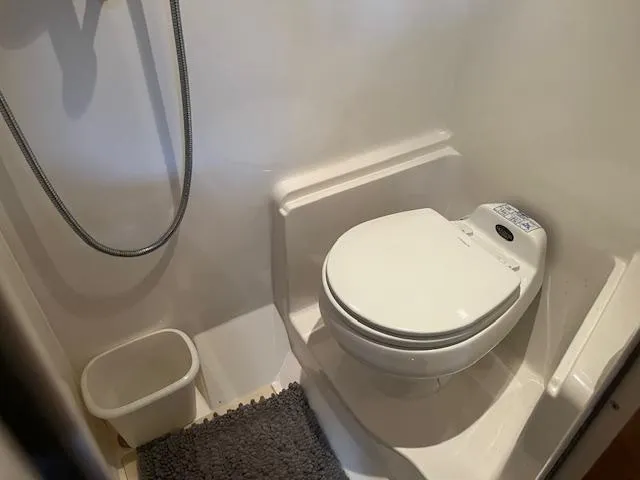 Slide: The Image of Compact bathroom in 2003 Regal 3860 boat with toilet and shower. - 35