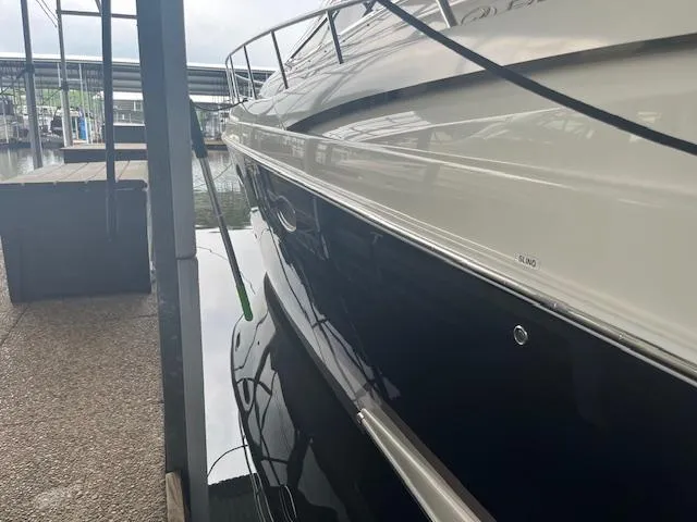 Slide: The Image of 2003 Regal 3860 yacht docked, showcasing sleek design and polished exterior. - 7