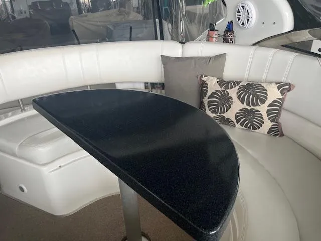 Slide: The Image of Luxurious interior of 2003 Regal 3860 yacht with elegant seating and stylish table. - 9