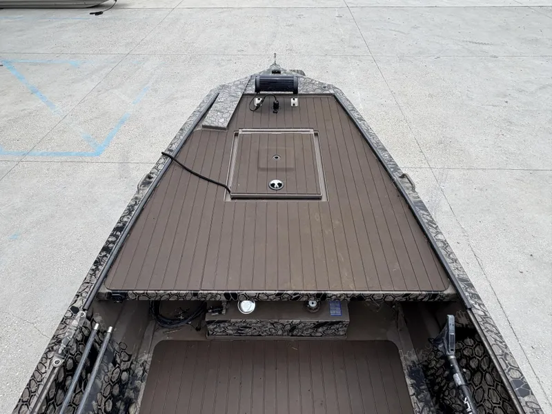 Slide: The Image of 2024 Pro-Drive X Series boat deck with storage compartment, featuring a sleek, modern design. - 13