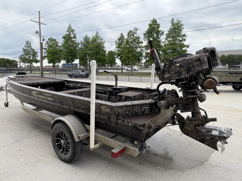 Slide: The Image of 2024 Pro-Drive X Series boat on trailer, featuring a powerful outboard motor. - 2