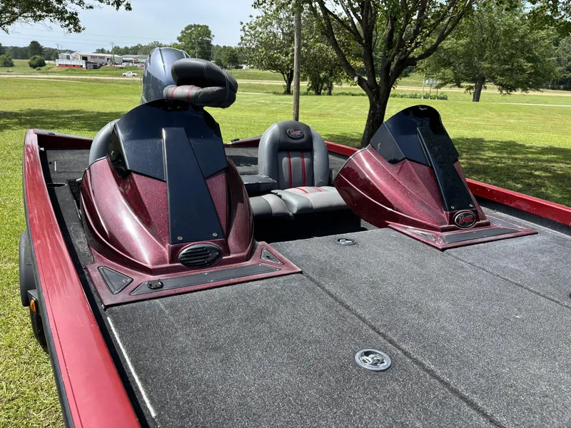 Slide: The Image of 2015 Ranger RT188 boat with dual consoles and seating, parked on grass. - 10