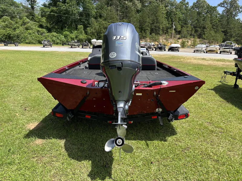 Slide: The Image of 2015 Ranger RT188 boat with outboard motor on grassy area. - 12