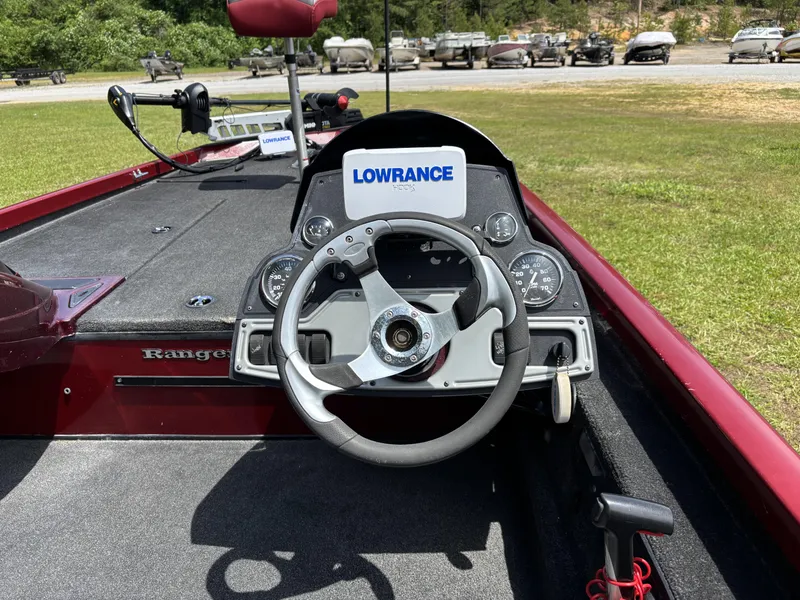 Slide: The Image of 2015 Ranger RT188 boat dashboard with steering wheel and Lowrance electronics. - 13