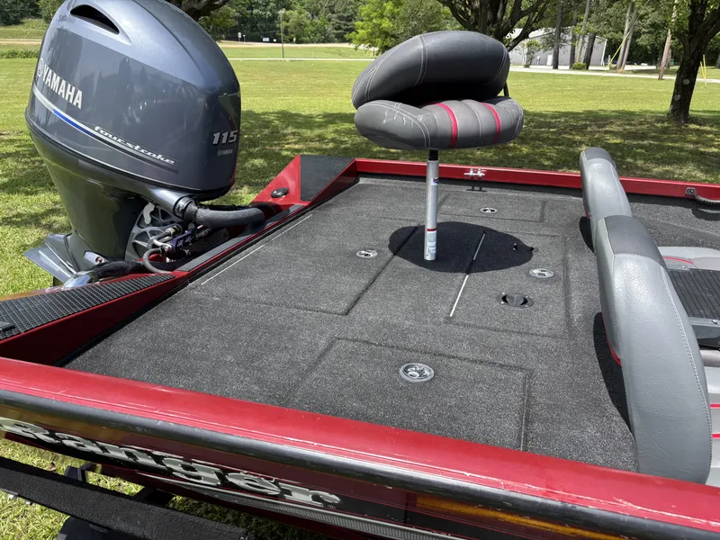 Slide: The Image of 2015 Ranger RT188 boat with Yamaha 115 engine, featuring spacious deck and seating. - 14
