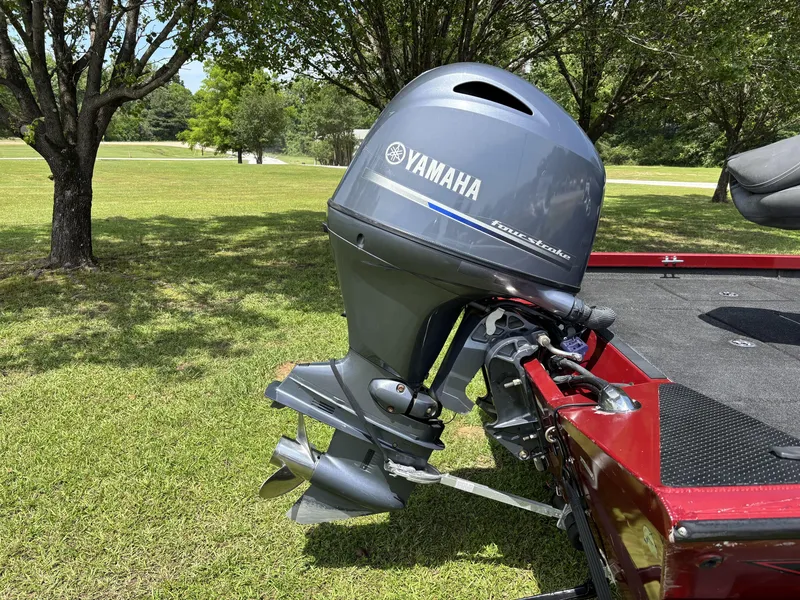 Slide: The Image of 2015 Ranger RT188 boat with Yamaha four-stroke outboard motor on grassy area. - 7