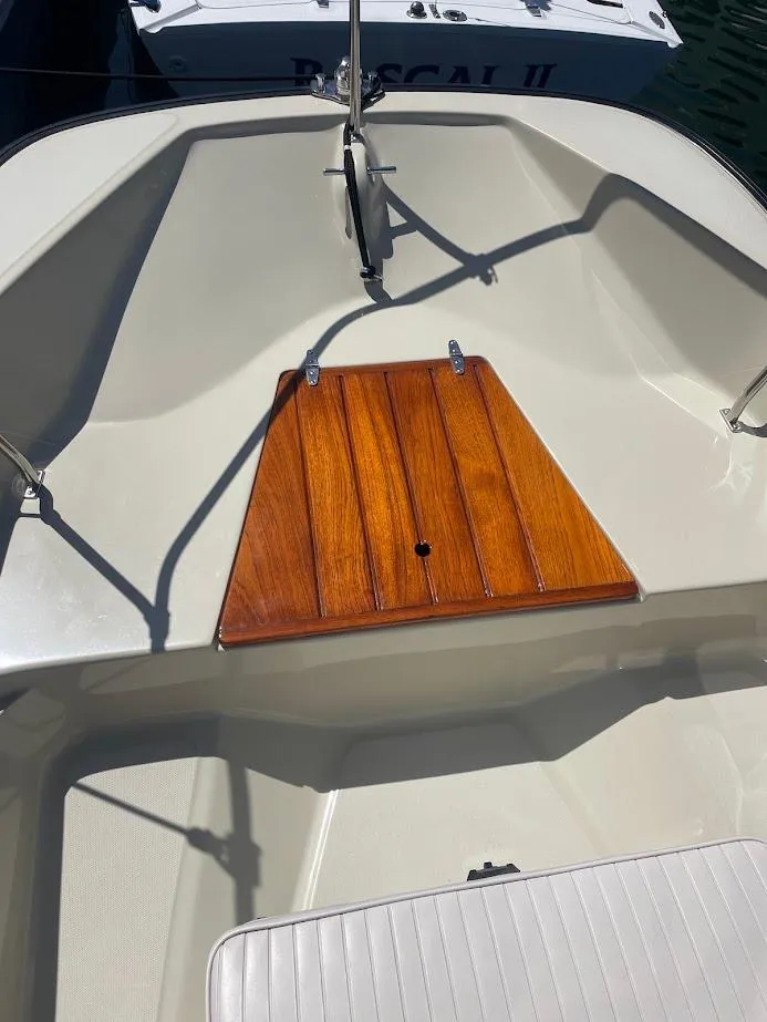 Slide: The Image of 1983 Boston Whaler 17 Montauk boat interior with wooden deck detail. - 5