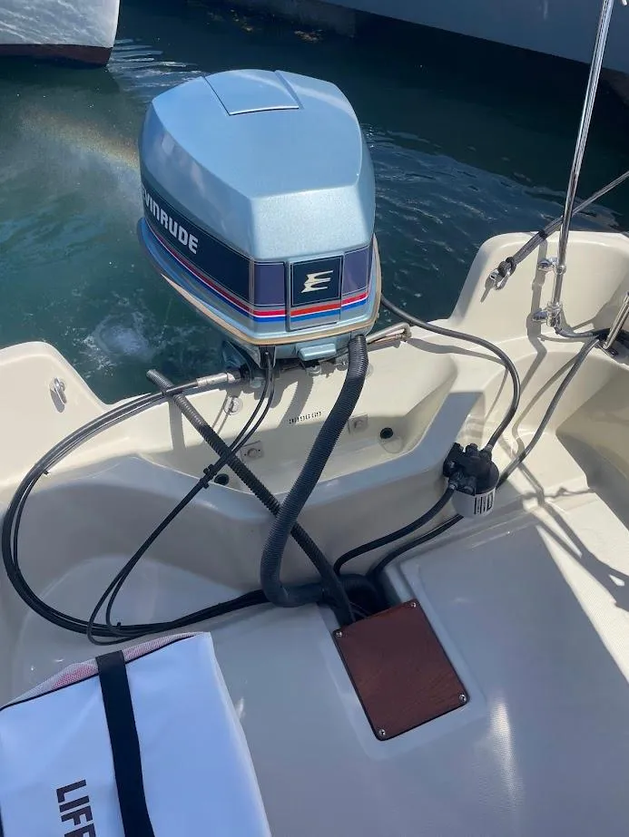 Slide: The Image of 1983 Boston Whaler 17 Montauk with Evinrude outboard motor in water. - 8