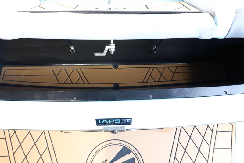 Slide: The Image of 2022 Tigé 25ZX boat interior with TAPS 3T system, featuring stylish deck design. - 10