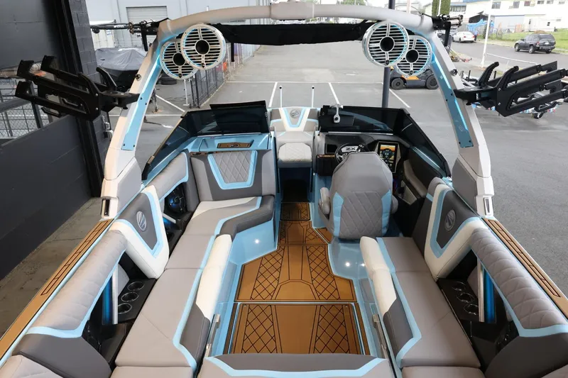 Slide: The Image of 2022 Tigé 25ZX boat interior with modern seating and advanced audio system. - 11