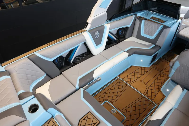 Slide: The Image of 2022 Tigé 25ZX boat interior with luxurious seating and stylish design. - 12