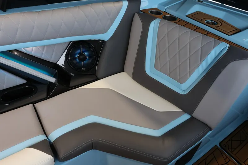 Slide: The Image of 2022 Tigé 25ZX boat interior with stylish, modern seating and integrated speaker system. - 14