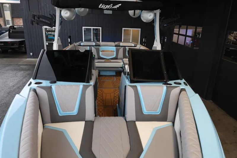 Slide: The Image of 2022 Tigé 25ZX boat interior with modern seating and sleek design. - 20