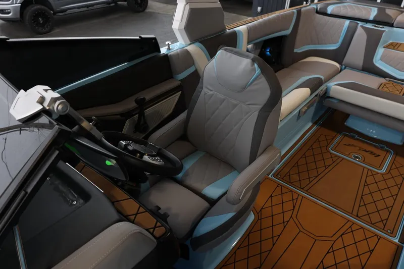 Slide: The Image of 2022 Tigé 25ZX boat interior with modern seating and sleek design. - 22