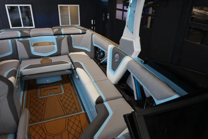 Slide: The Image of 2022 Tigé 25ZX boat interior with modern seating and stylish design. - 23