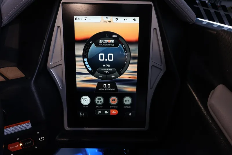 Slide: The Image of 2022 Tigé 25ZX boat dashboard display showing speed and control settings. - 26