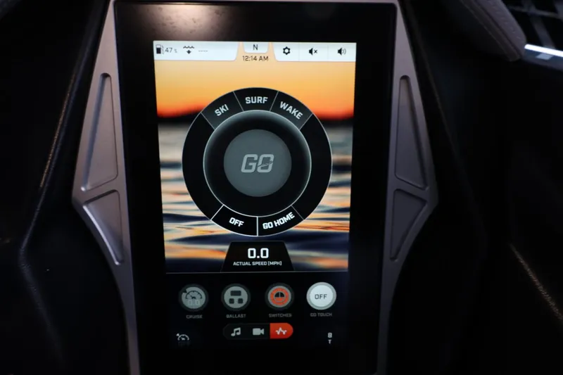 Slide: The Image of Touchscreen display in 2022 Tigé 25ZX boat showing ski, surf, and wake options. - 27