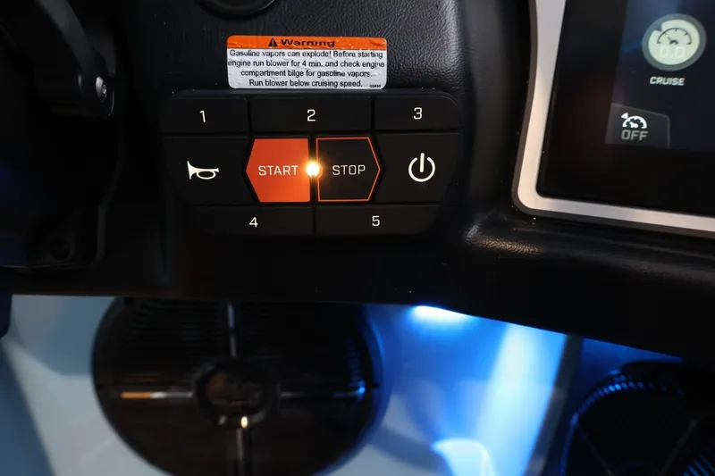 Slide: The Image of Control panel of 2022 Tigé 25ZX boat with illuminated start button. - 30