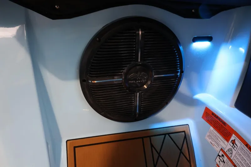 Slide: The Image of 2022 Tigé 25ZX boat interior speaker with ambient blue lighting. - 32