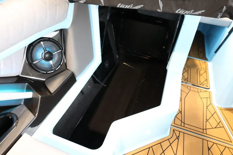 Slide: The Image of 2022 Tigé 25ZX boat interior with speaker and storage compartment. - 34
