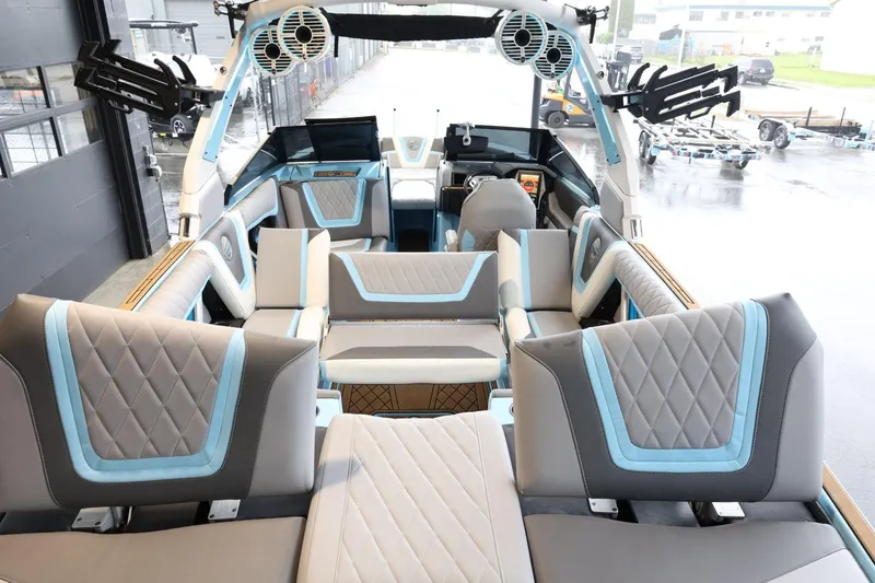Slide: The Image of 2022 Tigé 25ZX boat interior with modern seating and advanced audio system. - 38