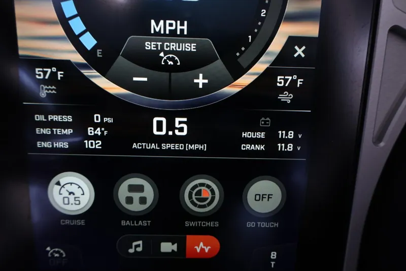 Slide: The Image of 2022 Tigé 25ZX dashboard display showing speed, engine temperature, and control settings. - 44