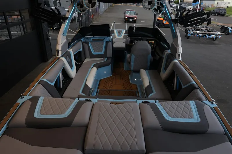 Slide: The Image of 2022 Tigé 25ZX boat interior with luxurious seating and modern design. - 9