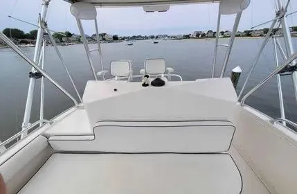 Slide: The Image of 2005 Cabo 35 Flybridge Sportfisher interior with seating and water view. - 11