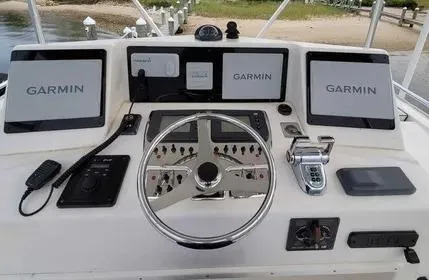 Slide: The Image of Helm of 2005 Cabo 35 Flybridge Sportfisher with Garmin navigation displays. - 7