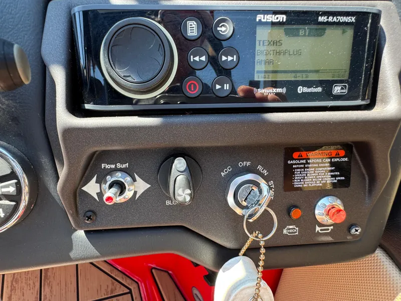 Slide: The Image of Control panel of a 2022 Moomba Makai boat with stereo and ignition system. - 28