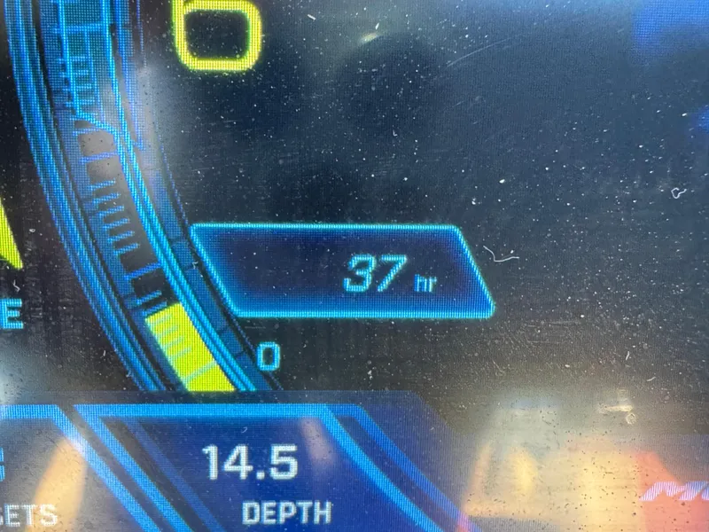Slide: The Image of Dashboard display of a 2022 Moomba Makai showing 37 hours and 14.5 depth. - 30