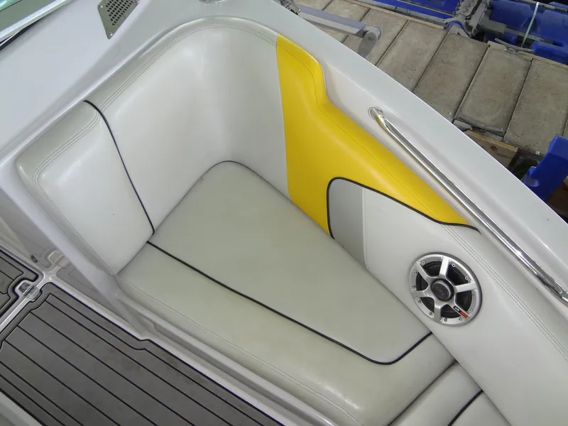 Slide: The Image of 2008 Correct Craft Super Air Nautique 230 boat in a covered marina. - 14